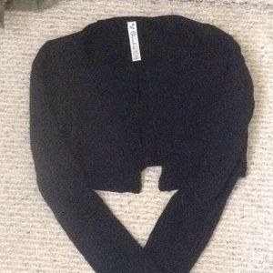 A black long sleeved cover up for girls